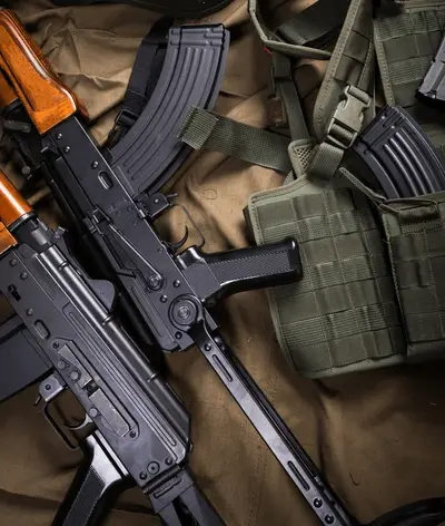 AK-style rifles with magazines on tactical gear
