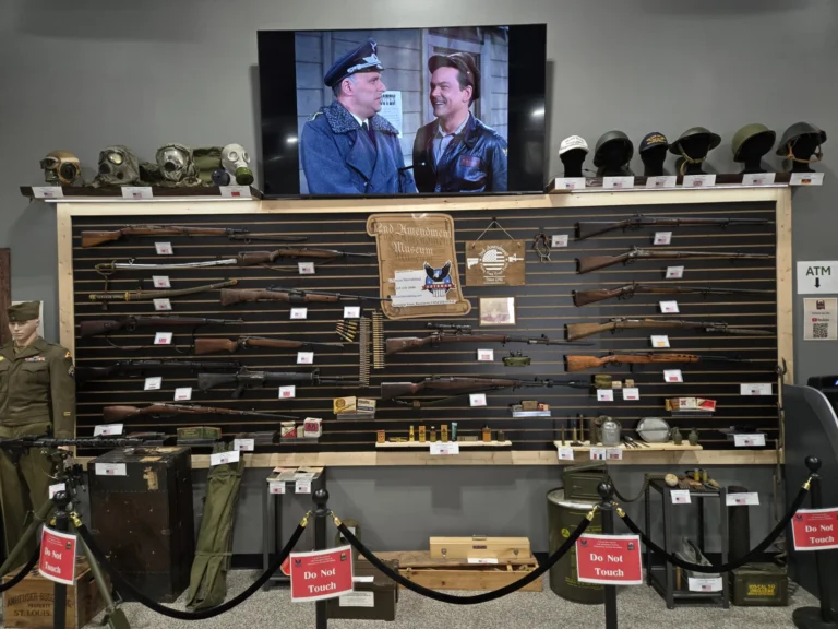 Historical firearms and military artifacts displayed in the 2 If By Sea Tactical Second Amendment Museum