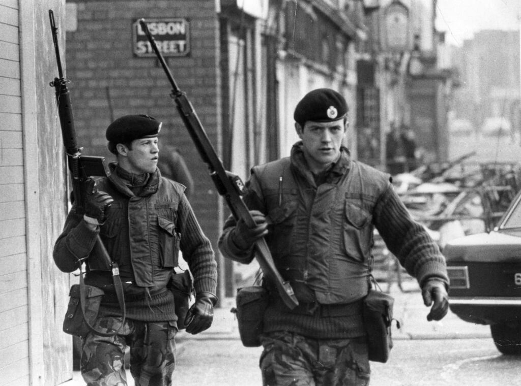 1972: Armed British soldiers on patrol in Lisbon Street, Belfast, during the Official IRA's unconditional ceasefire.