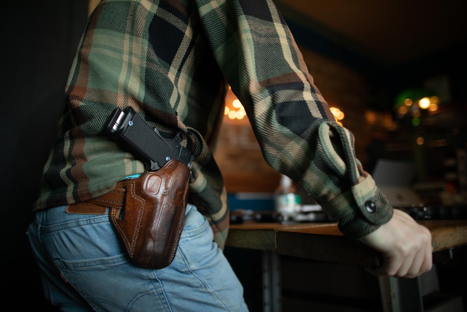 Man open carrying a firearm