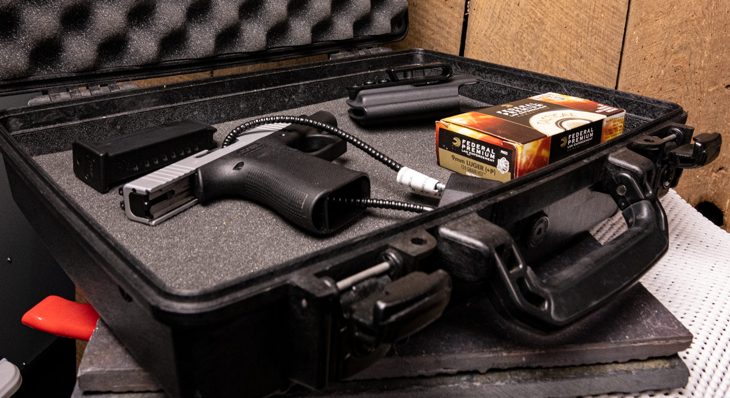 A pistol in a locked case secured for transport