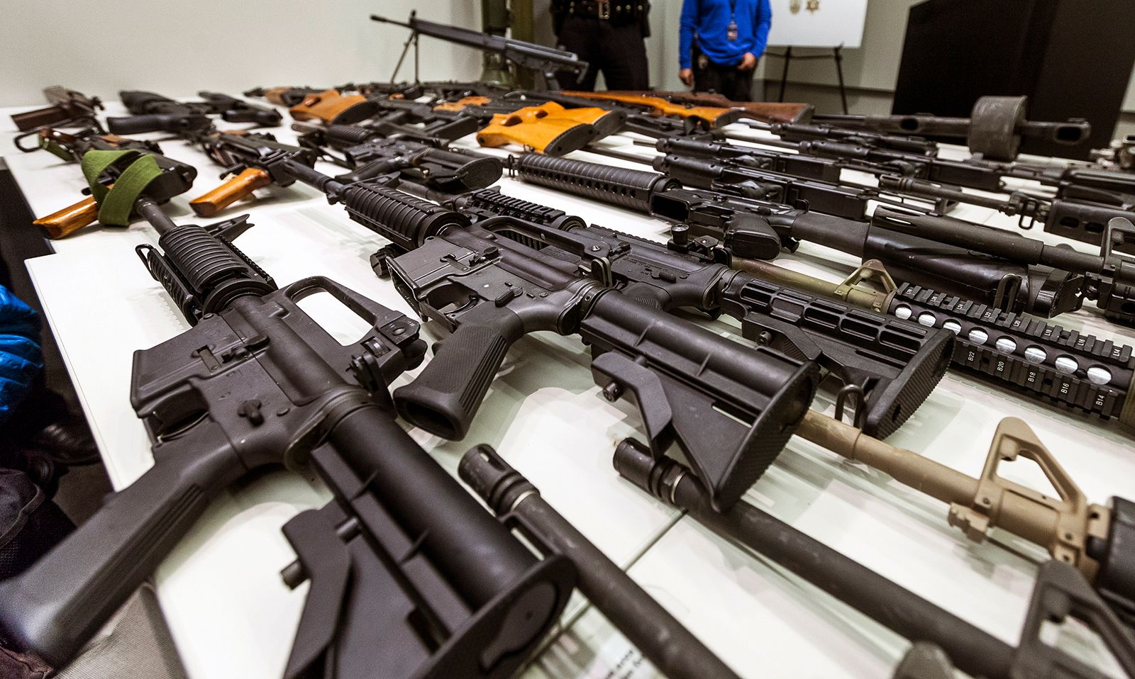 A variety of semi-automatic rifles obtained during a buy-back program are displayed at Los Angeles police headquarters