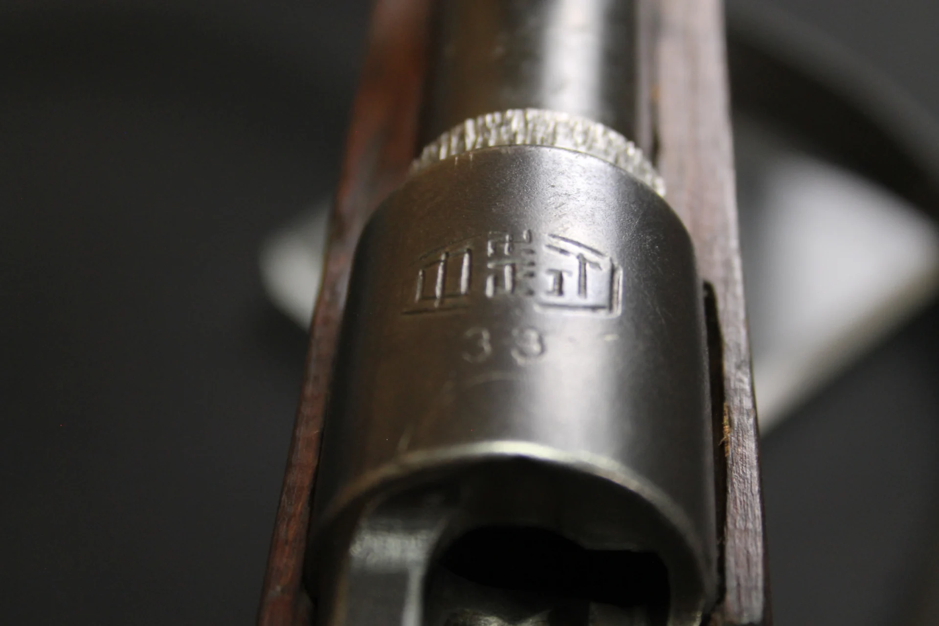 Close-up of a historic firearm barrel marking